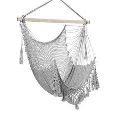 a white hammock hanging from a wooden pole