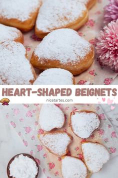 heart shaped doughnuts with powdered sugar on top and pink flowers in the background