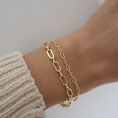 Beautiful chain bracelet is minimalist, delicate, and dainty. Featuring a textured design, making it unique and special. Great for stacking or for a minimalist look! THICK, durable plating of 14k Gold or Rhodium over brass – for a piece that will be with you for years to come! Nickel-free & Hypoallergenic Available in 6.25”, 6.75”, or 7" + .5" Ext Lobster Clasp Closure Width: 5mm Paperclip Bracelet, Dainty Gold Bracelet, Gold Armband, Bracelet Dainty, Dainty Bracelet, Silver Chain Style, Bracelet Chain, Chain Silver, Trombone