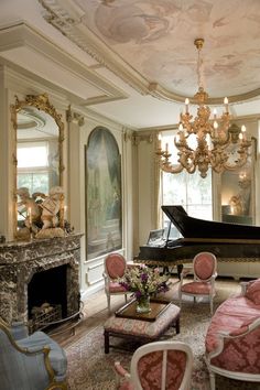 a living room filled with furniture and a grand piano