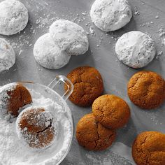 cookies and powdered sugar on a baking sheet