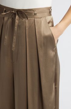 Luxe silk brings a fluid drape to polished pants fashioned with a neatly pleated high waist and ankle-grazing wide legs. 24 1/2" inseam; 30" leg opening; 16" front rise; 18 1/2" back rise (size 8) Zip fly with hook-and-bar closure Front slant pockets; back welt pockets 100% silk Dry clean Imported removable belt Sleek Silk High-waisted Wide Leg Pants, Elegant Spring Bottoms With Folds, Fall Viscose Wide Leg Work Pants, Fall Workwear Viscose Wide Leg Pants, Fall Wide Leg Viscose Pants For Work, Chic Summer Wide Leg Pants With Pleated Waist, Elegant Solid Bottoms With Folds, Formal Summer Bottoms With Pleated Waist, Chic Satin Ankle-length Bottoms