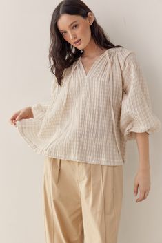 Introducing Amente's Textured Cotton Linen Blend Peasant Blouse - a versatile addition to your wardrobe. Made from a blend of cotton and linen, this blouse offers a lightweight and breathable feel with a subtle texture that adds depth to the fabric. Designed with a classic peasant blouse silhouette, featuring flowy sleeves and a relaxed fit, this top exudes bohemian-inspired charm. The textured cotton linen blend enhances the shirt's rustic appeal, giving it a relaxed and effortlessly chic vibe. Peasant Shirt, Fashion Top Outfits, Flowy Sleeves, Flowy Blouse, Peasant Blouse, Peasant Tops, Overall Dress, S Models, Boutique Clothing