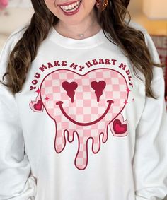 Express your romantic sentiments with our "You Make My Heart Melt Graphic Tee." This charming shirt, available in sizes YXS to 5XL, is perfect for celebrating Valentine's Day or expressing your love year-round. The eye-catching design features a melting heart, symbolizing the warmth and affection you feel.
Choose from a variety of styles, including short sleeve, long sleeve, v-neck, and sweatshirt, to suit your preferred look and the weather. The shirt's versatile design makes it a delightful addition to your wardrobe, allowing you to showcase your romantic side in comfort and style.
The "You Make My Heart Melt" graphic adds a touch of sweetness and playfulness to your outfit, making it an ideal choice for casual outings, date nights, or any occasion where you want to share your love. The Valentine's Day Slogan Top With Crew Neck, Valentine's Day Slogan Crew Neck Top, Cute Slogan Tops For Valentine's Day, Valentine's Day Cute Slogan Tops, Cute Text Print Tops For Valentine's Day, Cute Heart Print Tops For Valentine's Day, Funny Crew Neck Tops For Valentine's Day, Funny Letter Print Tops For Valentine's Day, Funny Valentine's Day Tops With Letter Print