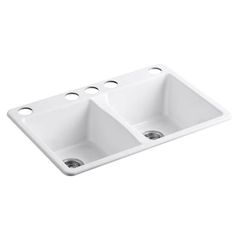 a white double bowl kitchen sink