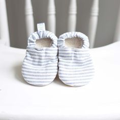 "Our booties are constructed from soft, flexible and breathable material which allows baby to move and wiggle their feet without feeling restricted. They feature an inner Sherpa lining, making them cozy against baby's skin. A comfortable enclosed elastic heel our baby booties stay on wiggly feet!  Baby booties features : Main: 100% Cotton  Vegan Suede Sole : 100% polyester Non-slip vegan suede sole make them the perfect shoe for little ones crawling, cruising or learning to walk Sizing : To ensure proper fit, please measure your child's foot from heel to big toe and add 1/2 an inch for wiggle room. Monthly sizes are only an estimate. There are 4 sizes available which range from newborn thru 12 months. 0-3 months measures 4.0\" from toe to heel 3-6 months measures 4.5\" from toe to heel 6-9 Comfortable White Slippers With Soft Sole, White Comfortable Slippers With Soft Sole, White Casual Slippers For Playtime, Comfortable White Moccasins With Round Toe, White Comfortable Round Toe Moccasins, White Non-slip Slippers For Playtime, Comfortable Soft Booties For Playtime, Comfortable Non-slip White Booties, Comfortable White Closed Toe Booties