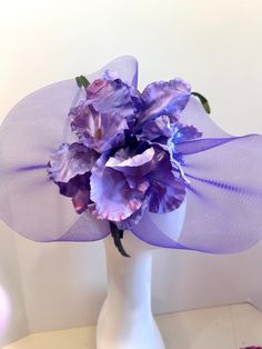 "Iris Purple /Blue hat- wedding -Flower Hat- Flower Headband- Derby- Spring Headband-  Hello,              This horse hair netting/ fascinator has a 3 large purple iris's. Dyed in various shades of purple and blue. The matching net piece is about 14\" wide by 11-12\" wide. colors: all purple all white It's on a skinny 1/2\" black satin covered headband that is adjustable to fit any head size and very comfortable. Plus, take it off  and you have no hat hair!   I've been making hair pieces over 20 years. I love what I do and I hope you do too!  - -------------------------------------------------- I ship US Postal Service.       USA DOMESTIC CHOICES (From mailed date in business days) First Class:  Arrives 3-6 days.(no insurance) Priority:        Arrives 1-3 days.                     Express: Lavender Hat Fascinator For Spring, Lavender Fascinator Hat For Spring, Purple Spring Fascinator Hat, Lavender Fascinator For Spring, Adjustable Lavender Fascinator For Evening, Adjustable Lavender Fascinator For Weddings, Purple Spring Hat Headpiece, Purple Headband With Handmade Flowers, Purple Headpieces For Spring Races