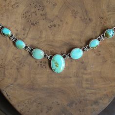 If you are a lover of natural turquoise, this is the natural, turquoise necklace you've been waiting for. 7 cabochons of natural, gorgeous, old-stock Hubei Turquoise. Brand new in the LBJ lineup, this listing is for the multi-stone turquoise necklace in the photos. Such a great-looking and feeling necklace. Dressy and casual at the same time, this turquoise necklace is so easy to wear you may forget you have it on. Set in oxidized and polished, .925 Sterling Silver setting from integrated .925 S Vintage Untreated Turquoise Necklace, Untreated Vintage Turquoise Necklace, Oval Chrysoprase Necklaces With Natural Stones, Oval Chrysoprase Natural Stone Necklace, Turquoise Chrysocolla Necklace With Patina, Turquoise Cabochon Chrysocolla Necklace, Bohemian Oval Turquoise Necklace With Natural Stones, Oval Chrysocolla Necklace With Natural Stones, Artisan Untreated Turquoise Necklace