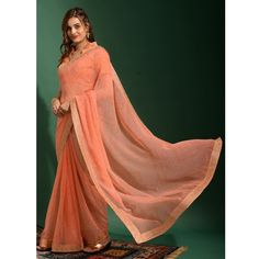 Peach colored saree is made from georgette fabric which is highlighted with beautiful bandhani pattern with cording border work as shown. comes along unstitched banglori silk blouse piece which you can customise as per your design/style. Occasion - You can wear this saree for parties, festive and functions ideal for any fashionista. Note:- The actual product may differ slightly in color and design from the one illustrated in the images when compared with computer or mobile screen. Measurements: Bandhani Pattern, Peach Color Saree, Embroidered Border, Mobile Screen, Georgette Saree, Georgette Fabric, Georgette Sarees, Blouse Piece, Design Style