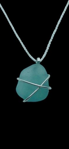 IDEAL CHRISTMAS GIFT!  This delicate handcrafted sea glass pendant is made with a beautifully smoothed deep teal blue nugget found in Kintyre on the west coast of Scotland. The glass is wrapped in 1mm 925  sterling silver wire and is suspended from a hand-formed silver bail.  Choose your preferred chain length at checkout.     Other similar items available: * Pendants https://etsy.me/48jz6JC * Rings https://etsy.me/49nLolF * Tideline Limited Edition https://etsy.me/3y8FBCL * Bangles & bracelets Adjustable Wire Wrapped Necklace In Recycled Glass, Adjustable Wire Wrapped Necklaces In Recycled Glass, Blue Sea Glass Wire Wrapped Jewelry, Blue Sea Glass Jewelry Gift, Sea Glass Round Necklace As Gift, Blue Sea Glass Jewelry As A Gift, Wire Wrapped Sea Glass Jewelry Gift, Wire Wrapped Sea Glass Jewelry For Gifts, Round Sea Glass Necklace As A Gift