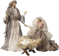 three nativity figurines, one with a baby jesus in the manger