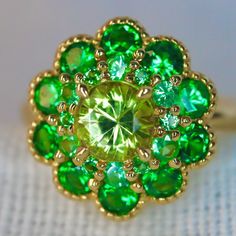 Yellow Mali Garnent Ring. With neon green tsavorite garnet. Set in 14K yellow Gold. A beautiful and unique neon yellow garnet ring, created in double halo hydrangea settings to create a luxurious and high-quality piece of jewelry, perfect to express your love. 💎 PREMIUM RING -- A brand new garnet ring, personally designed and made with the highest quality of 14K yellow gold. It is designed ✨ CLASSIC BRILLIANCE -- Designed with a beautiful neon yellow mali garnet at the center and neon green tsa Oval Multi-stone Emerald Ring, Fine Jewelry Green Multi-stone Emerald Ring, Green Multi-stone Emerald Ring Fine Jewelry, Oval Green Gemstone Cluster Ring, Green Multi-stone Emerald Rings, Green Multi-stone Emerald Ring For May Birthstone, Green Cluster Ring With Halo Setting, Green Halo Setting Cluster Ring Fine Jewelry, Yellow Gold Rings With Tsavorite In Halo Setting