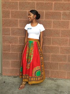 African Maxi Pleated skirt With Pockets. That extra something in your closet that is a statement piece. This skirt is custom made.  Made from Waxed cotton fabric that is very comfortable to wear. Zipper closure in the back.  Custom made to fit you perfectly. Waist measurement needed for special order.  The pictures shown are examples of my work. Price is the same for ALL SIZES. Dry clean recommended. Or wipe with a damp cloth.  Iron with a warm iron on wrong side. COLORS AVAILABLE ARE  LOCATED ON THE COLOR CHART ON THE LAST TWO PAGES. Size chart by waist size as follows: xs (23-25) sm (26-28) m (29-30) ml (31-33) l(34-36) xl(37-39) xxl(40-43) xxxl(44-47). This skirt is ankle lenght for an average height woman(5'5"). Please specify if you require extra length in the comments.  Thank you. African Skirt Outfit, Dashiki Skirt, African Print Long Dress, African Skirt, African Print Maxi Skirt, African Print Skirt, African Skirts, Ankara Skirt, Print Maxi Skirt