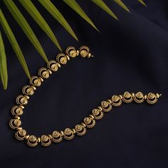 Description: This necklace, Priam, is the best example of simplicity. It is raw and traditional with delicate tribal motifs used to accentuate the look. It is crafted in gold plated with oxidized finish to give the definite earthy charm. It is beautifully framed to feel light around your neck. Details & Specifications: Materials used: Brass Alloy with Antique Gold platting Weight – Necklace-26 Length – Necklace-13 Make it custom Want to make it a custom necklace? Sure! Reach out to us at support Gold Oxidized Temple Jewelry Necklace, Temple Jewelry Gold Necklace With Oxidized Finish, Antique Gold Brass Necklace For Festive Occasions, Gold Temple Necklace With Oxidized Finish For Festive Occasions, Festive Gold Temple Necklace With Oxidized Finish, Antique Gold Necklace With Tilla For Gifts, Traditional Gold Bridal Necklace With Oxidized Finish, Gold Temple Necklace With Oxidized Finish Pendant, Gold Temple Necklace With Oxidized Pendant