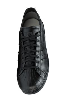 A monochromatic upper with decorative stitching adds a clean, sporty vibe to a low-profile leather sneaker set on a rubber cupsole. Lace-up style Removable insole Leather upper/textile lining/rubber sole Imported Decorative Stitching, Up Styles, Sneakers Black, Leather Sneakers, Low Profile, Rubber Sole, Leather Upper, Stitching, Nordstrom