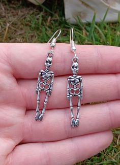 Silver plated earring hooks with skeleton charms 💀 Skull-shaped Metal Earrings, Bone Colored Metal Earrings For Pierced Ears, Metal Skull Single Earring, Silver Skull Earrings With Ear Wire, Nickel-free Bone Dangle Earrings, Nickel-free Bone-colored Dangle Earrings, Nickel Free Bone Color Dangle Earrings, Bone Color Dangle Earrings With Ear Wire, Skull Shaped Metal Earrings For Gifts