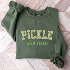 Vintage Canned Pickles Sweatshirt, Canning Season Sweatshirt, Pickle Lovers Sweater, Homemade Pickles Sweater,Pickle Jar Crewneck Sweatshirt * Unique cute gift for everyone that is incredibly easy and stress-free to order & receive * Design is a the words Golden mama writing with trendy retro color and font. * Softest quality 50% cotton, 50% polyester with loose fit that runs true to size (unisex) * Extreme comfort with no bulky side seams for great shape and fit that lasts * Collar is ribbed knit, so it retains its shape even after washing * Our unique designs are professionally permanently printed with Direct to Garment printing which feels smooth and flexible :: Printed with Eco-Friendly Inks :: Printed and Shipped from the USA :: Double-Needle Stitching Throughout :: Made to Last *50% Cute College Tops For Fall, Cute Spring College Tops, Cute Tops For College In Spring, Fall Cotton Tops With School Spirit Style, Fall Cotton Tops For School Spirit, Green Cotton Sweatshirt For School, Collegiate Tops For School In Fall, Green School Tops For Fall, Green Long Sleeve Tops For School Spirit