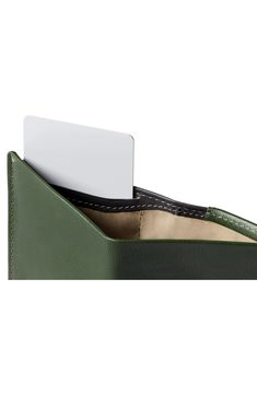 A well-organized interior ensures superior easy and convenience with this RFID-protected wallet. It has a smart pull-tab compartment so you don't have to dig for things, and its made from premium calfskin for lasting appeal. Interior currency pouch; pull-tab slip pocket; three card slots Leather Imported Functional Green Rectangular Wallet, Modern Leather Organizer For Everyday Use, Green Trifold Wallet With Rfid Blocking For Daily Use, Green Trifold Wallet For Everyday Use, Green Rectangular Trifold Wallet With Rfid Blocking, Green Rfid Blocking Trifold Wallet, Modern Organizer With Card Slots For Everyday Use, Modern Wallet With Cell Phone Pocket For Everyday Use, Green Trifold Wallet With Card Slots For Everyday Use