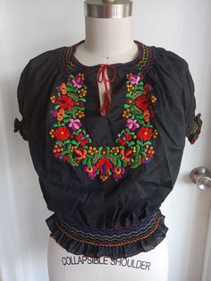 Vintage Hungarian Blouse Embroidered Peasant Top Ethnic Folk Shirt 1980s. Matyo style blouse with handmade matyo embroidery. Features ruched crew neck and short sleeves embroidered with scattered tiny flowers. Measures as an XS. Please see precise measurements. Folk Style Peasant Top With Multicolor Embroidery For Festival, Folk Style Multicolor Embroidered Peasant Top For Festivals, Folk Style Embroidered Peasant Top For Festivals, Traditional Embroidered Multicolor Peasant Top, Folk Style Peasant Top With Multicolor Embroidery, Multicolor Folk Style Short Sleeve Peasant Top, Multicolor Folk Peasant Top With Short Sleeves, Multicolor Short Sleeve Folk Peasant Top, Vintage Embroidered Peasant Top For Festival