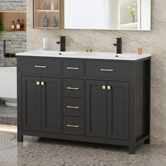 a bathroom vanity with two sinks and a large mirror over the bathtub in front of it