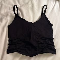 Free People Movement Top Athletic, Supportive Top Cropped With Corset Like Rouging Detail Black Spaghetti Straps - Not Adjustable Never Worn - New Condition Size Xs/S Casual Black Ruched Tank Top, Casual Black Tops With Straps, Black Ruched Tank Top For Summer, Casual Bra Friendly Top For Night Out, Ruched Black Crop Top For Summer, Casual Black Crop Top With Built-in Bra, Casual Black Spaghetti Strap Crop Top, Black Fitted Camisole Casual Style, Fitted Black Casual Camisole