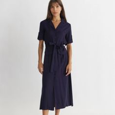 100% Rayon The Perfect Basic Roll Sleeve Midi Dress. This Beauty Features A V-Neckline, Button Front, And Cargo Pocket Details. Lightweight Soft Material That Is Perfect For Warm Weather And Can Be Easily Layered With A Jacket When It Cools Down. Navy V-neck Midi Dress For Spring, V-neck Shirt Dress With Button Closure For Casual Wear, V-neck Shirt Dress With Button Closure, V-neck Viscose Shirt Dress For Summer, Elegant Rayon Shirt Dress For Summer, Chic Belted Rayon Dresses, Workwear Maxi Dress With Button Closure And Short Sleeves, Short Sleeve Maxi Dress With Button Closure For Work, Workwear Maxi Dress With Short Sleeves And Button Closure