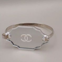 Chanel Cc Logo Mirror Bangle Bracelet 03c Silver France Accessory Sku ( Kp77 Nt3 ) Details Brand Chanel Style Bracelet Color / Material Silver/Silver Plated,Plastic Country Of Manufacture France Serial Number 03c Dimension Bande Width ( Inch ) W 0.2 0 " (Approx.) Bande Width ( Cm ) W 0.5 Cm (Approx.) Weight Gram(Full Measure.) 0 G (Approx.) Inner Circumference(Inch/Cm) 6.7 - 0 "/ 17 - 0 Cm(Approx.) Come With ( Accessories) - - - - - - Example Of Ranks S New,Unused Sa Less Frequently Used Items A Logo Mirror, T Bracelet, Jewelry Chanel, Chanel Style, Chanel Jewelry, Chanel Fashion, Cc Logo, Womens Jewelry Rings, Bangle Bracelet