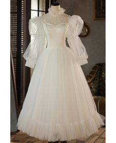 Buy retro beaded pearls tea length tulle wedding dress with high neck long sleeves at wholesale price online. Free shipping and pro custom service since 2009. Wedding Dress With High Neck, Retro Wedding Dress, Antique Wedding Dresses, Tea Length Tulle, Dress With High Neck, Wedding Dress Ivory, Long Wedding Dress, Bridal Gowns Vintage, Dress Design Sketches