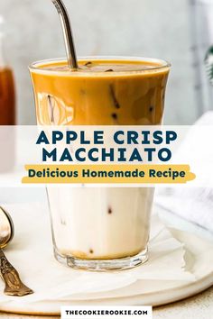 an apple crispy macchato is served in a tall glass with a spoon