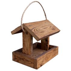 a wooden birdhouse with a rope hanging from it's roof, on a white background