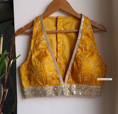 This Made to Order/Made to Measurement/Custom Made Indian Ethnic Blouse. - Fabric - Gold Embroidered Silk - Color - Amber Yellow - Padded - Princess Cut - Plunge Neckline - Lined - Sleeveless - Borders around the waist and Neckline - Extra margin and extra stitches included in the blouse PLEASE NOTE: BUYERS ARE RESPONSIBLE FOR ANY CUSTOMS AND IMPORT TAXES THAT MAY APPLY. This is a made to order product. If you opt for 'Made To Measurement Option', we will provide a measurement template and you can share the measurements likewise. If you want to opt for 'Standard Size', Please refer to the size chart provided in the listing. Shipping: Standard Shipping is done by DHL ecommerce and it mostly takes 2 to 3 weeks to deliver after dispatch. Express Shipping is done by DHL express and it mostly d Luxury Yellow Unstitched Blouse, Cheap Yellow Blouse Piece For Diwali, Luxury Semi-stitched Yellow Blouse, Cheap Yellow Semi-stitched Blouse, Blouse Design For Big Bust, Mustard Yellow Blouse Designs, Silk Saree Lehenga, Yellow Blouse Designs, Gold Silk Saree