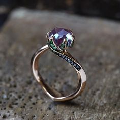 a close up of a ring on a rock