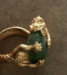 "Vintage Estate 14K 16.3 g Dragon Eating Green Jade Ring. Size: 9. Jade- 3/4\"x1/2\". Markings: 14K ( Ring was resized so the mark have been partially erased but still show partial markings). Amazing large piece. Dragon represent luck. Dragon eating jade signifies abundant wealth, luck and good health attained. Beautiful Details. Sold as is. Pre- Owned." Unique Untreated Yellow Gold Jewelry, Unique Untreated 14k Gold Jewelry, Gold Tsavorite Emerald Ring For Formal Occasions, Unique Oval 14k Stamped Jewelry, Formal Gold Emerald Ring With Tsavorite, Fine Jewelry Yellow Gold Emerald Ring For Collectors, Collectible Green 14k Stamped Jewelry, Unique 14k Gold Rings With Lost Wax Casting, Collectible 14k Gold Green Jewelry