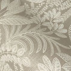 an image of a close up view of a fabric with flowers and leaves on it