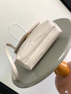 Size: 23cm*15cm*10cm It comes with Dust box, Care manual, Tag, and Paper bag. Designer Everyday Flap Pouch Bag, High-end Beige Flap Bag For Daily Use, Elegant Baguette Bag With Large Capacity, Designer Beige Baguette Bag In Pouch Shape, High-end Beige Rectangular Flap Bag, High-end Beige Shoulder Flap Bag, Trendy Pouch Flap Bag With Top Carry Handle, High-end Everyday Flap Bag With Removable Pouch, Beige Shoulder Flap Bag With Dust Bag Included