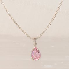 💎 A crystal pink necklace that will amaze you with its mini and 3D cut. The necklace is a great complement to other necklaces and is also stylish and elegant on its own. 💎 We offer chain lengths from 14-26 inches. You can give your custom size if you want to use it as a chooker. Suitable for 12-14 inch chooker. 💎 Also perfect for gifting to your loved ones. A gift for your mommy, sister and bestfriends to your daughter. Moreover, we make it a special gift package for you. 💎 October birthston Pink Dangle Charm Necklaces, Pink Briolette Necklace For Gift, Dainty Pink Drop Jewelry, Elegant Pink Teardrop Pendant Drop Necklace, Pink Pear-shaped Gemstone Necklace, Pink Dangle Necklaces With Gemstones, Pink Teardrop Pendant Necklace In Dainty Style, Elegant Pink Teardrop Drop Necklace, Pink Pear-shaped Gemstone Jewelry