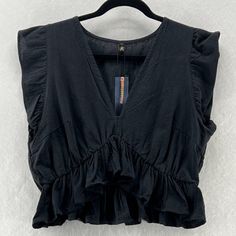 Fancyinn Crop Blouse Womens Sz L V-Neck Ruffle Sleeve Peplum Cotton Blend Black New With Tags. Please Refer To Pictures For Condition And Measurements. All Items Are Stored In A Pet-Free, Smoke-Free Environment. Items Typically Ship Next Business Day. Sold As Pictured, Thank You For Looking. Our Sku: 12n51-22 Elegant V-neck Peplum Top With Ruffles, Summer V-neck Peplum Top With Ruffle Hem, Chic V-neck Peplum Top With Ruffles, V-neck Ruffle Blouse For Night Out, V-neck Peplum Top For Party, Chic V-neck Peplum Top For Party, Fitted V-neck Peplum Top With Ruffles, Chic V-neck Peplum Top For Summer, Summer V-neck Peplum Top With Ruffles