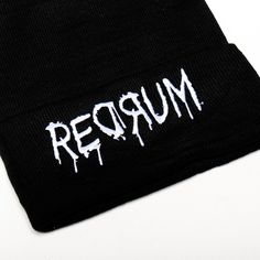 Introducing the Redrum Beanie, a high-quality unisex black acrylic beanie that's both durable and comfortable. Featuring an intricate embroidery design, this beanie is a true statement piece, perfect for adding a bold touch to any outfit. Enjoy lasting comfort and standout style with this exceptional accessory. Streetwear Beanie With Letter Print, Letter Print Beanie For Streetwear, Fitted Beanie For Streetwear, Trendy Black Adjustable Beanie, Black Cotton Beanie Cap, Black Beanie With Letter Print For Streetwear, Trendy Adjustable Black Beanie, Black Beanie With Letter Print For Winter, Unisex Black Beanie Hat