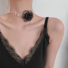 ✦ Indulge in the delicate beauty of our Elegant Pearl Bead Flower Choker Necklace. The intricate mesh flower pendant, adorned with a lustrous pearl, makes this necklace a true statement piece. The vintage-inspired design adds a touch of nostalgia and femininity to any outfit. Whether you're attending a wedding, a formal event, or simply want to express your unique style, this flower choker is a stunning choice. Gift it to someone special or wear it yourself to exude elegance and grace. ---------- DETAILS ----------- - - Color: Ivory/ Black - Materials: Fabric, Faux Pearl, Mesh - Necklace Length: 34.4cm + 5.1cm extension- SKU: HN3463 Flower Choker Outfit, Black Formal Wear, Romantic Black And White, Flower Pearl Necklace, White Choker Necklace, Pearl Rope, Elegant Choker, White Choker, Flower Choker Necklace