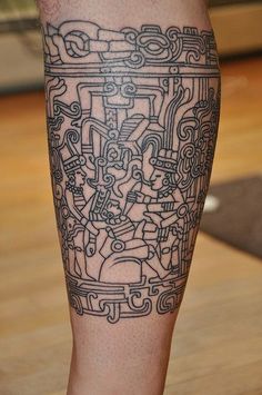 a man's leg with an intricate tattoo design on the calf and lower leg