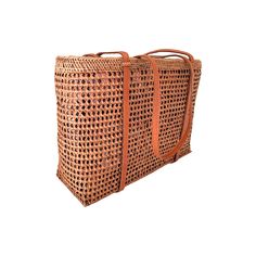 This versatile mesh tote bag is a must-have for any Summer occasion. With its stylish design and convenient size, it's the perfect companion for your resort, beach, or cruise vacation. Its neutral honey color makes it easy to coordinate with any outfit. (PRODUCT INFO): Features drawstring closure Size: 10" height x 14" width x 5" depth inches Fully lined interior with batik print 100% cotton Material: Ata/rattan (SHIPPING INFO): All our items are made-to-order, therefore please allow 3-5 busines Travel Basket Shoulder Bag With Open Weave, Summer Beach Bucket Bag With Top Carry Handle, Beach Bag With Top And Double Carry Handles, Eco-friendly Straw Beach Bag With Top Carry Handle, Beach Tote Crochet Bag With Top Carry Handle, Beach Crochet Tote Bag With Top Carry Handle, Brown Open Weave Beach Bag For Everyday Use, Large Capacity Basket Bucket Bag For Travel, Natural Color Tote Bag With Reinforced Handles