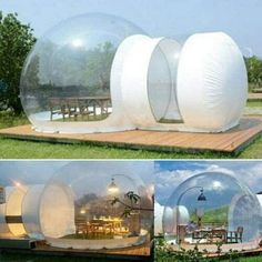 there are three large clear bubble houses in the grass, and one has a dining table inside