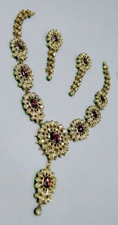 "Vintage 22K solid gold, Old cut Diamonds set with multicolor Enamel work necklace (Kundan Meena choker)with Matching Earrings. A nice old design from the 60s with old cut diamonds. A solid piece of jewelry set with color stones great workmanship. Length of necklace -28 cm (11.02\") Size could be adjusted according to your requirement by adding an adjustable cord. The width of Centerpiece-7 cm (2.75\"), the total weight of set -100.860 Grams (3.55 ounce). Length of earrings-6.5 cm,width of earri Hand Set Yellow Gold Round Kundan Necklace, Yellow Gold Kundan Necklace With Meenakari For Puja, 22k Gold Kundan Necklace With Meenakari, Ceremonial Yellow Gold Kundan Necklace With Meenakari, Ceremonial Kundan Meenakari Necklace In Yellow Gold, Yellow Gold Round Bridal Necklace With Meenakari, Celebration Kundan Necklace With Meenakari In 22k Gold, Yellow Gold Kundan Necklace For Puja, Temple Jewelry With Motifs For Diwali