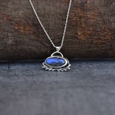 ✦ Embrace the Divine with this fine quality Labradorite crystal Necklace. This stunning dainty genuine labradorite necklace features fine quality labradorite smooth Oval cabochon with Blue color flashes. all held together by 925 solid sterling silver. could turn out to be a best gift for this mother's day to make her feel young again. Wearing a Labradorite crystal necklace will surround your body with positive and healing energies that will prevent any misfortunes coming your way. You can use th Silver Labradorite Dainty Jewelry, Dainty Silver Labradorite Jewelry, Handmade Silver Labradorite Necklaces, Labradorite Round Pendant Necklace As Gift, Bohemian Silver Labradorite Necklaces, Handmade Silver Labradorite Necklace, Bohemian Silver Labradorite Necklace, Dainty Silver Labradorite Necklace, Dainty Labradorite Pendant Necklace