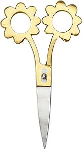 a pair of gold scissors with flowers on them