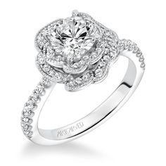 a white gold engagement ring with diamonds on it