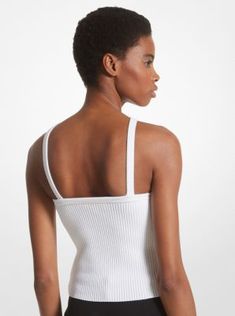 The minimal design of this tank top means it can be worn throughout the warmer months with ease. Defined by a halter neckline, it’s cut from a ribbed viscose blend infused with stretch for a flattering, body-hugging fit. For a chic yet relaxed look, style it with tonal pants in a wide-leg silhouette. Ribbed Spring Tank Top With Minimal Stretch, Ribbed Tank Top With Minimal Stretch For Spring, Ribbed Fitted Tank Halter Top, Ribbed Fitted Halter Tank Top, Fitted Ribbed Halter Tank Top, Spring Halter Neck Tank Top With Seamless Construction, Modern Fitted White Tank Top, Seamless Sleeveless Halter Top For Spring, Spring Sleeveless Seamless Halter Top