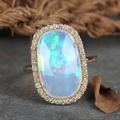 "\"Details: Item code :- ATR-2400 - 14K yellow solid gold (as shown) wt :1.60 gm - 0.32 ct diamonds - 3.19 ct opal - Ring size 20 x 13 mm & ring size 7 us Anjis touch jewelry supports ethical and eco-friendly practices and uses reclaimed and recycled metals whenever possible About my jewelry: All of the Anjis touch jewelry collection is handmade exclusively by me.  I hope that you will enjoy wearing my designs as much as I enjoy making them! Shipping: We have this in stock which we can ship in 2 Luxury Adjustable Opal Ring For Gift, Luxury Elegant Cluster Opal Ring, Luxury Yellow Gold Brilliant Cut Opal Ring, Luxury Brilliant Cut Yellow Gold Opal Ring, Cocktail Christmas, Boulder Opal Ring, White Diamond Earrings, Unique Rings Vintage, Colored Stone Rings