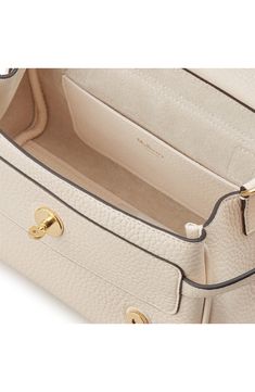 Mulberry relaunches the cult Alexa bag—named for the British fashion icon—detailed with a signature postman's lock and a hand-braided top handle. Highly sought after since its first release in 2010, this satchel is given a sustainable update with supersoft, naturally grained calfskin leather sourced from an LWG-certified tannery. Turnlock with magnetic-snap flap closure Top carry handle; removable, adjustable shoulder strap Interior wall pocket Structured silhouette with flat base for stability Timeless Luxury Everyday Bag With Flap, Everyday Luxury Satchel Bag With Turn-lock Closure, Luxury Everyday Satchel Shoulder Bag With Turn-lock Closure, Designer Top Handle Bag With Turn-lock Closure, Designer Satchel Shoulder Bag With Turn-lock Closure, Designer Flap Bag With Turn-lock Closure And Top Handle, Luxury Satchel Flap Bag With Turn-lock Closure, Designer Satchel With Gold-tone Hardware And Flap, Beige Double Handle Bag With Turn-lock Closure