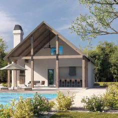 a house with a pool in the front yard and an outdoor kitchen on the other side